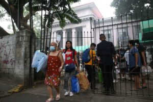 The nurses evacuated their patients due to a fire at the Philippine General Hospital (PGH) Main Building on Wednesday, which reached the 3rd alarm. The said fire continues to be extinguished. PHOTO BY: RENE H. DILAN