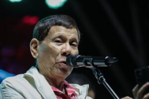 Former president Rodrigo Duterte talks to the crowd at the SMNI prayer rally in Manila, Tuesday evening, March 12, 2024. PHOTO BY J. GERARD SEGUIA