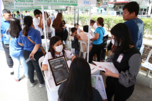 Residents line up at a job fair in Manila on Wednesday, March 13, 2024, as part of the city's 'Kalinga sa Maynila' program. PHOTOS BY RENE DILAN