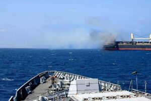 This handout photograph taken on March 6, 2024 and released by the Indian Navy shows the Barbados-flagged bulk carrier following a attack by Yemen's Huthi rebels, in Gulf of Aden. A missile fired by Yemen's Huthi rebels hit a bulk carrier in the Gulf of Aden on March 6, with the crew reporting three people killed and at least four wounded, the US military said. INDIAN NAVY / AFP