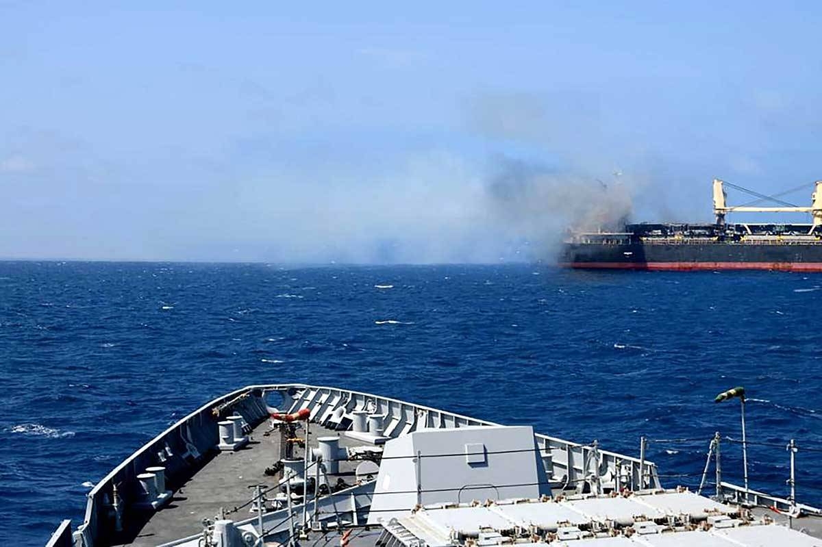 This handout photograph taken on March 6, 2024 and released by the Indian Navy shows the Barbados-flagged bulk carrier following a attack by Yemen's Huthi rebels, in Gulf of Aden. A missile fired by Yemen's Huthi rebels hit a bulk carrier in the Gulf of Aden on March 6, with the crew reporting three people killed and at least four wounded, the US military said. INDIAN NAVY / AFP