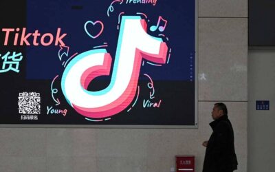 A man walks past an advertisement featuring the TikTok logo at a train station in Zhengzhou, in China’s central Henan province on January 21, 2024. GREG BAKER / AFP