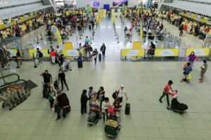 Passengers of Cebu Pacific Airlines line up as they check in for boarding at the NAIA Terminal 3 in Pasay City. Photo by: J. Gerard Seguia