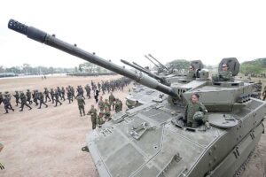 WOMEN ON TOP Three women of the Philippine Army (PA) pose atop one of its tanks as they and the rest of the troops put on a show of the PA’s defense capabilities on its 127th anniversary in Capas, Tarlac, on Friday, March 22, 2024. Defense Secretary Gilbert Teodoro Jr. (not in photo) delivered the speech on behalf of President Ferdinand Marcos Jr., who was unable to attend for health reasons. PHOTO BY RENE H. DILAN