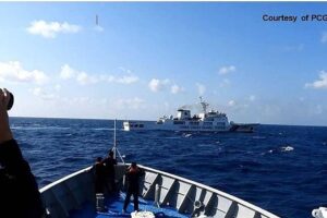 In this handout frame grab video footage on March 21, 2024 and received from Philippine Coast Guard (PCG) on March 22, shows a Chinese Coast Guard ship (top) maneuvering past a Philippine Coast Guard ship near Sandy Cay reef, near the Philippine-held Thitu Island in Spratly Islands, in the disputed South China Sea. The Philippine Coast Guard on March 22 accused a Chinese vessel of 'dangerous maneuvers' as it attempted to block Filipino scientists from reaching a reef in the South China Sea.
Handout / Philippine Coast Guard (PCG) / AFPAF