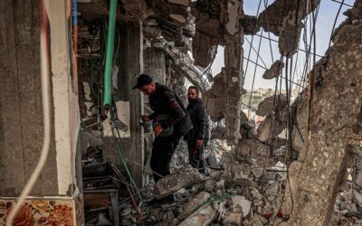 International Call for Immediate Ceasefire in Gaza: Urgent Action Needed to Address Humanitarian Crisis People inspect damage to a building that was hit overnight during Israeli bombardment in Rafah in the southern Gaza Strip on March 26, 2024 amid the ongoing conflict in the Palestinian territory between Israel and the militant group Hamas. SAID KHATIB / AFP