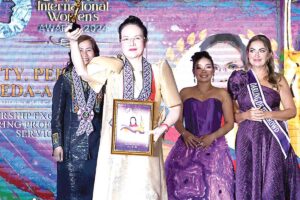 Public Attorney’s Office chief Persida Rueda-Acosta accepts her trophy from Crystal International Women Award on Friday, March 22, 2024. CONTRIBUTED PHOTO