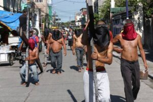 Flagellants walk on the streets of Barrio San Jose in Caloocan City and Mandaluyong on Maundy Thursday, March 28, 2024. They are a familiar sight during the Holy Week and inflicting pain on themselves is their way of atoning for their sins. PHOTOS BY RENE H. DILAN