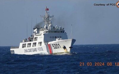 In this handout frame grab video footage taken on March 21, 2024 and received from Philippine Coast Guard (PCG) on March 22, shows a Chinese Coast Guard ship shadowing a Philippine Coast Guard ship (not pictured) near Sandy Cay reef, near the Philippine-held Thitu Island in Spratly Islands, in the disputed South China Sea. The Philippine Coast Guard on March 22 accused a Chinese vessel of "dangerous manoeuvres" as it attempted to block Filipino scientists from reaching a reef in the South China Sea. Handout / Philippine Coast Guard (PCG) / AFP