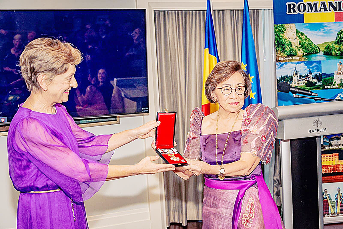 ‘COMMENDABLE’ WORK Former Foreign Affairs secretary Delia Albert (right) is conferred the National Order of Merit with the rank of commander by the Romanian government on March 19, 2024 for her ‘commendable’ work in enriching Philippine-Romania ties. Romanian President Klaus Werner Iohannis bestowed the honor through his ambassador to the Philippines, Răduta Dana Matache. PHOTO COURTESY OF MAICA TEVES