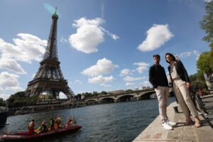 12 MONTHS TO GO Amelie Oudea-Castera (right), minister for Sport and the Olympic and Paralympic Games of France, and Tony Estanguet, president of the Paris 2024 Organizing Committee, watch a parade on the River Seine to test maneuvers, distances, duration and video capture of the future opening ceremony of the Paris Olympics, in Paris, France, Monday, July 17, 2023. XINHUA PHOTO