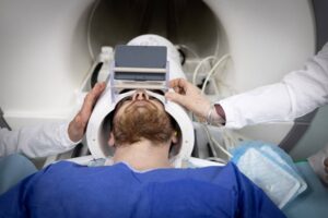 A volunteer takes part in a magnetic resonance imaging (MRI) exam simulation on the Iseult Magneton 11.7 T MRI at the Neurospin facilities in the Paris-Saclay Alternative Energies and Atomic Energy Commission (CEA - Commissariat a l'energie atomique et aux energies alternatives) centre in Gif-sur-Yvette, on March 22, 2024. AFP PHOTO