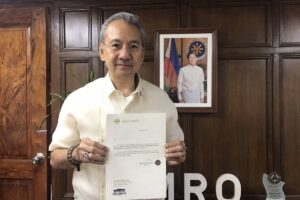 SECOND-IN-COMMAND Forensic expert Erwin Erfe shows his appointment paper as the new deputy chief of the Public Attorney’s Office (PAO). PHOTO COURTESY OF PAO CHIEF PERSIDA ACOSTA