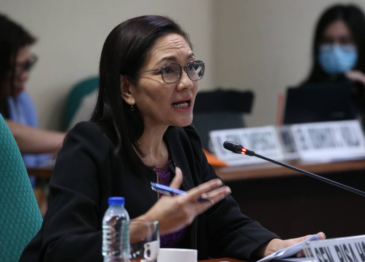 Sen. Risa Hontiveros talks to a witness at the third public hearing on Tuesday, March 5, 2024 by the Senate Committee on Women, Children, Family Relations and Gender Equality on the reported cases against the Kingdom of Jesus Christ founder Apollo Quiboloy. The pastor was cited in contempt and ordered arrested after he failed anew to attend the inquiry. PHOTOS BY RENE H. DILAN