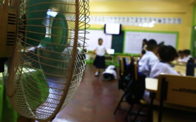 Philippines Schools Suspend In-Person Classes Due to Extreme Heat Students of the Justo Lukban Elementary School in Paco, Manila on Tuesday, April 2, 2024, gather near electric fans to cool themselves while in class. PHOTOS BY MIKE ALQUINTO