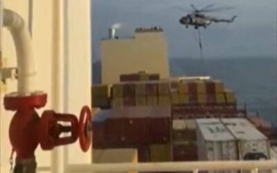 This image grab taken from a UGC video posted on social media on April 13, 2024 shows Iran's Revolutionary Guards rappelling down onto a container ship named, MSC Aries, near the Strait of Hormuz. Iran's Revolutionary Guards on Saturday seized a container ship "related to the Zionist regime (Israel) in the Gulf," state media reported, as tensions soar in the region. AFP PHOTO / XGTY