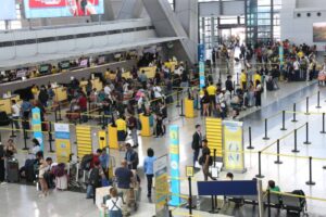Passengers in Terminal 3 of the Ninoy Aquino International Airport (NAIA) on Wednesday, March 27, 2024, secure tickets to go home to be with their loved ones during the Holy Week. PHOTOS BY RENE H. DILAN