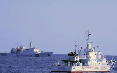 In this photo provided by the Philippine Coast Guard, a Chinese Coast Guard ship sails near a Philippine Coast Guard vessel during its patrol at Bajo de Masinloc, 124 nautical miles west of Zambales province, northwestern Philippines on March 2, 2022. A Chinese coast guard ship last month maneuvered for days near a research vessel deployed by Philippine and Taiwanese scientists to undertake a crucial survey of undersea fault lines west of the northern Philippines, sparking concerns among the scientists on board, officials said Thursday, April 7, 2022. Philippine Coast Guard via AP