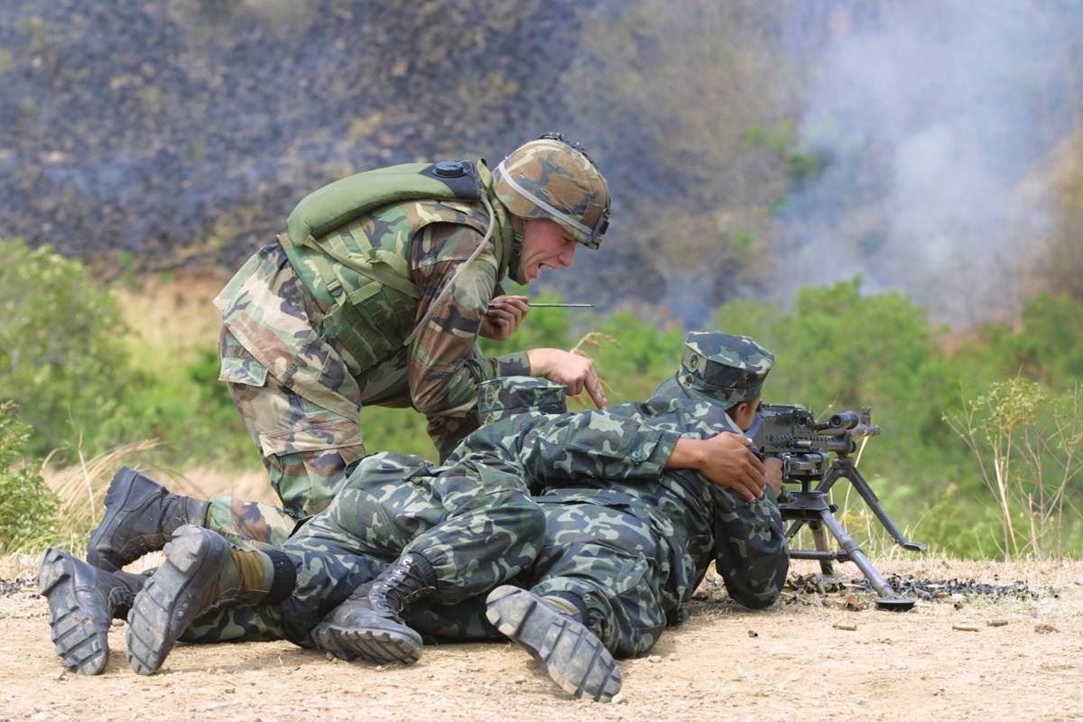 Philippine Marines with their American trainor during a live firing exercise with a 30 cal. machine gun as part of the Balikatan. File Photo