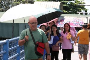 Umbrellas are used not just to block off the rain but as shade against the hot sun as shown in this photo taken of people crossing a foot bridge at Commonwealth, Quezon City on Tuesday, April 2, 2024. The Philippine Atmospheric, Geophysical and Astronomical Services Administration (Pagasa) advised people to protect themselves from the extreme heat. PHOTOS BY ISMAEL DE JUAN