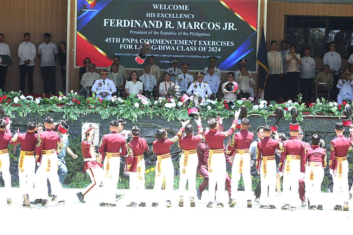 WHAT A FEELING Graduates from the Class of Layag-Diwa 2024 throw their caps high in the air in jubilation following their graduation at the Philippine National Police Academy (PNPA) in Silang, Cavite, on Friday, April 19, 2024. President Ferdinand Marcos Jr., as commander in chief, delivered a speech during the 45th PNPA Commencement Exercises where he called on the new policemen to ‘love and serve country above self.’ PHOTO BY RENE H. DILAN