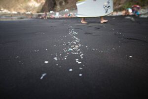 Microplastics and mesoplastic debris are pictured at Almaciga Beach, on the north coast of the Canary Island of Tenerife, on July 14, 2018, during a cleaning operation organized by the NGO ‘Canarias Libre de Plasticos’ (Canary Islands free of plastics). AFP