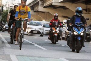 Bicycle riders are seen at the EDSA bike lane in Quezon City on Wednesday, April 24, 2024. The Metropolitan Manila Development Authority (MMDA), along with the Department of Transportation (DOTr), is considering removing the bicycle lane on EDSA to explore the possibility of building a dedicated motorcycle lane. According to the MMDA, only 1,500 cyclists use the bike lane daily compared to 170,000 motorcycles going through EDSA per day.  PHOTOS BY ISMAEL DE JUAN