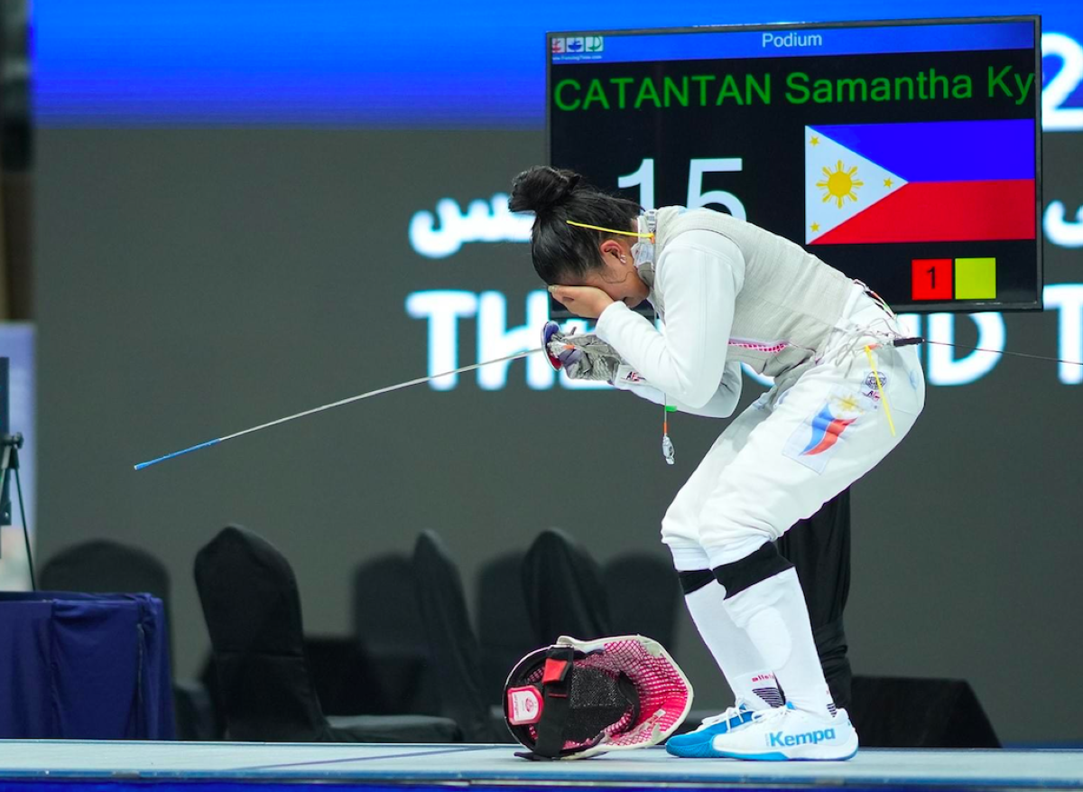 Samantha Catantan gets emotional after securing a spot in the 2024 Paris Olympics during the Asian & Oceania Olympic Qualification Tournament on Saturday night, April 27, 2024, at the Zayed Sports Complex in Fujairah, UAE. INTERNATIONAL FENCING FEDERATION PHOTO