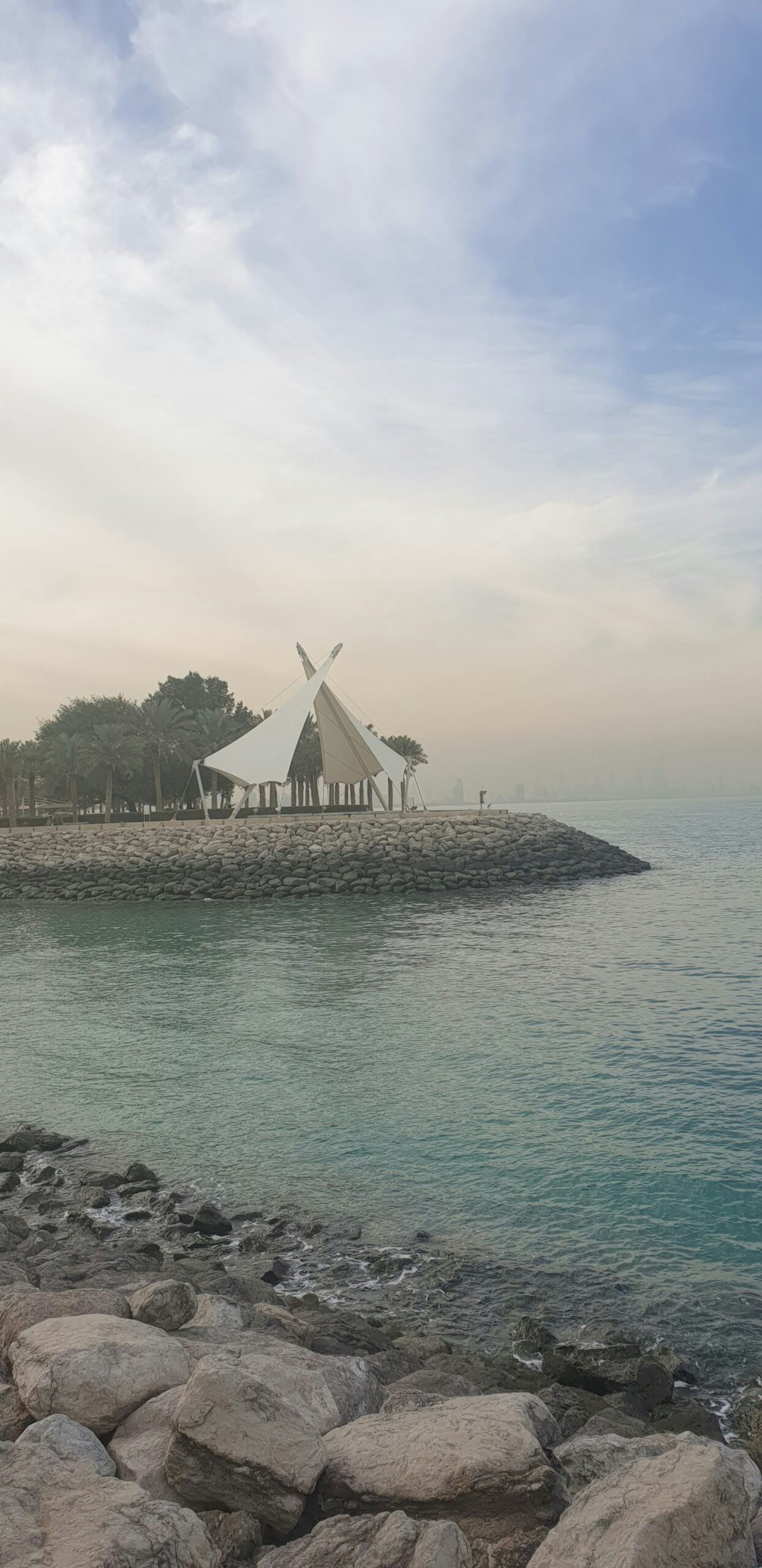 Salmiya Scientific Center: Discover the Wonders of Science and Nature 2024 a teepee sitting on top of a beach next to the ocean