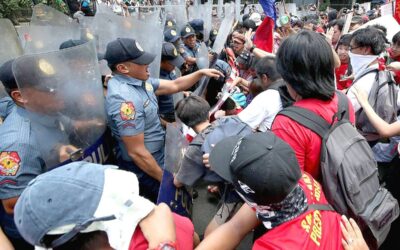 MAY FRAY Manila policemen stand their ground as Labor Day marchers attempt to get near the US Embassy in Manila on Wednesday, May1, 2024. PHOTO BY RENE H. DILAN