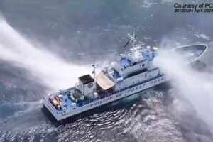 This frame grab from handout video footage taken and released on April 30, 2024 by the Philippine Coast Guard (PCG) shows the Philippine Coast Guard ship BRP Bagacay being hit by water cannon from Chinese coast guard vessels near the chinese-controlled Scarborough shoal in disputed waters of the South China Sea. The Philippines said the China Coast Guard fired water cannon on April 30 at two of its vessels, causing damage to one of them, during a patrol near a reef off the Southeast Asian country. Handout / Philippine Coast Guard (PCG) / AFP