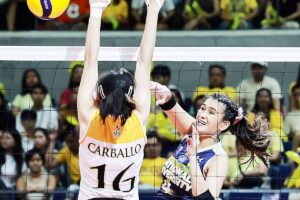 ONE WIN AWAY National University’s Bella Belen attacks against University of Santo Tomas’ Cassie Carballo during Game One of the UAAP Season 86 women’s volleyball best-of-3 Finals at the Smart Araneta Coliseum on May 11, 2024. PHOTO BY RIO DELUVIO