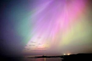 CELESTIAL LIGHT SHOW The aurora borealis, also known as the northern lights, glow on the horizon at St. Mary’s Lighthouse in Whitley Bay on the North East coast, England, May 10, 2024. The celestial light shows from Tasmania to Britain were triggered by the most powerful solar storm to strike the Earth in more than two decades and threatened possible disruptions to satellites and power grids as it persists into the weekend. PHOTO BY OWEN HUMPHREYS/PA VIA AP