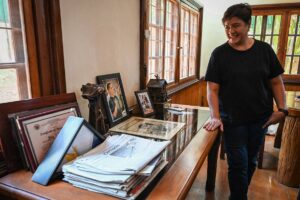 This photo taken on April 19, 2024 shows Patty Ortega, widow of slain Philippine environmental activist and radio host Gerry Ortega, looking at the photos and and paraphernalia related to her late husband at their home in Puerto Princesa in Palawan. After Philippine environmental activist and radio host Gerry Ortega was shot dead on the tropical island of Palawan, his family and friends were confident there was enough damning evidence to convict the alleged mastermind. But more than 13 years later, the man accused of ordering the hit, former provincial governor Joel Reyes, is still on the run, while his brother, who was also implicated, is a mayor.
JAM STA ROSA / AFP