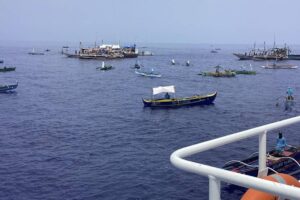 In this photo provided by the Philippine Coast Guard, fishing boats carrying activists and volunteers belonging to a nongovernment coalition called Atin Ito, Tagalog for This is Ours, pass by waters off Palauig Point, Zambales, as they head towards Scarborough Shoal on Wednesday May 15, 2024. PHILIPPINE COAST GUARD VIA AP