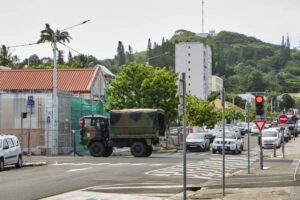 A truck of the French Gendarmerie drives down a street in Noumea, France's Pacific territory of New Caledonia on May 31, 2024. Daily life in New Caledonia is slowly returning to normal after the lifting of the state of emergency that had been imposed for nearly two weeks to quell intense rioting that killed seven people and injured hundreds. (Photo by Theo Rouby / AFP)