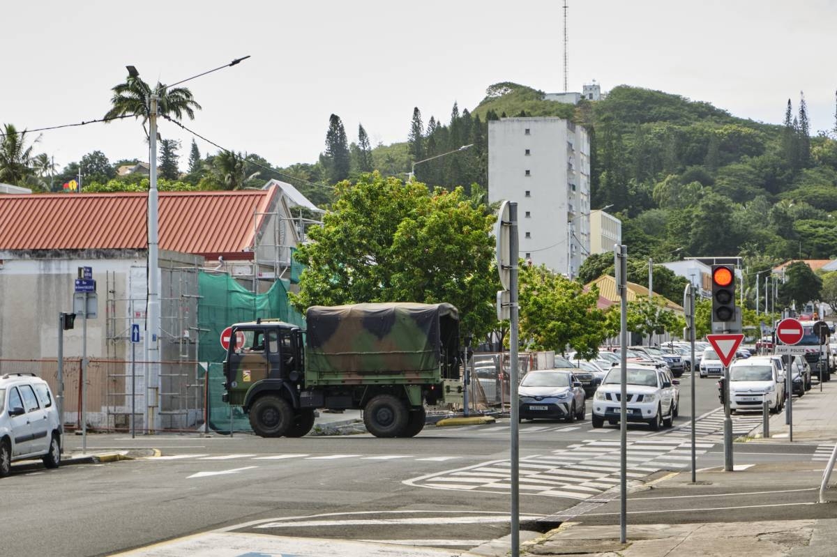 A truck of the French Gendarmerie drives down a street in Noumea, France's Pacific territory of New Caledonia on May 31, 2024. Daily life in New Caledonia is slowly returning to normal after the lifting of the state of emergency that had been imposed for nearly two weeks to quell intense rioting that killed seven people and injured hundreds. (Photo by Theo Rouby / AFP)