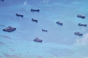 LIKE BEES TO HONEY This photo shows Chinese fishing vessels swarming off the Iroquois Reef and Sabina Shoal, south of the oil- and gas-rich Recto Bank in the West Philippine Sea. This was taken from an air patrol by the Armed Forces of the Philippines (AFP) on June 30, 2023. PHOTO COURTESY OF THE WESTERN COMMAND OF THE AFP