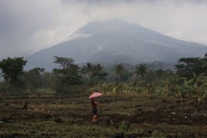 A resident holding an umbrella stands in a lot near their house at the foot of Mount Kanlaon volcano in a village in La Castellana, Negros Occidental province, central Philippines on June 4, 2024, a day after the volcano erupted.
Ferdinand Edralin / AFP